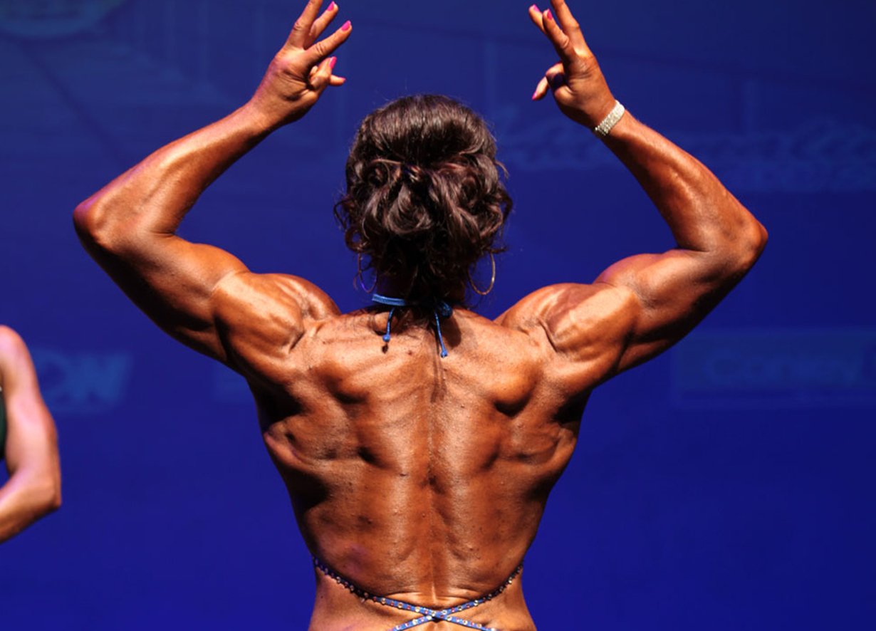 Ingrid Barclay Geelong bodybuilding coach doing rear double bicep pose in bikini