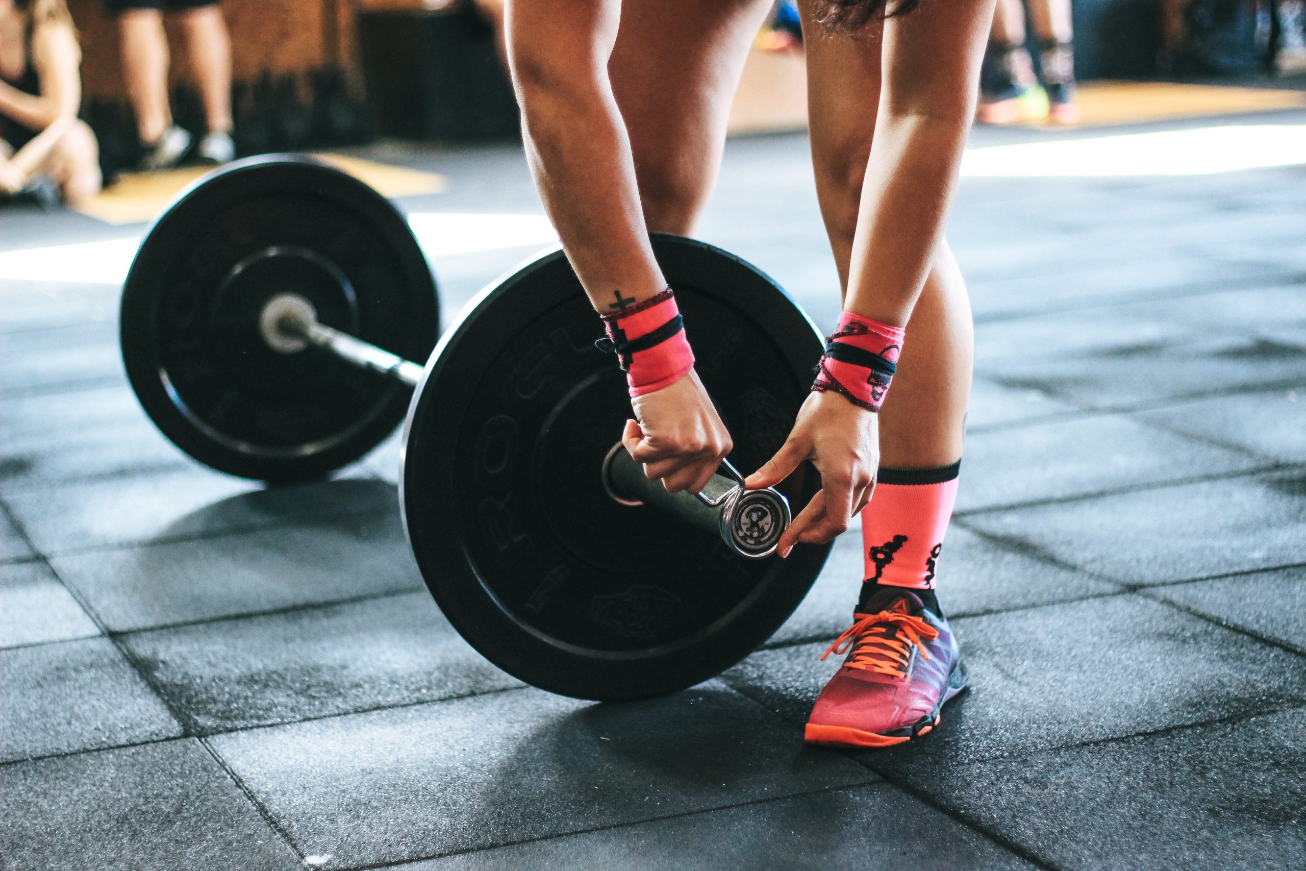 person holding barbell